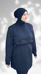 Model wearing a stylish navy Bade-Hijab swimwear featuring a comfortable, fitted design suitable for swimming.