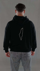 Oversize hoodie with map design on back, promoting comfort and freedom as a human right.